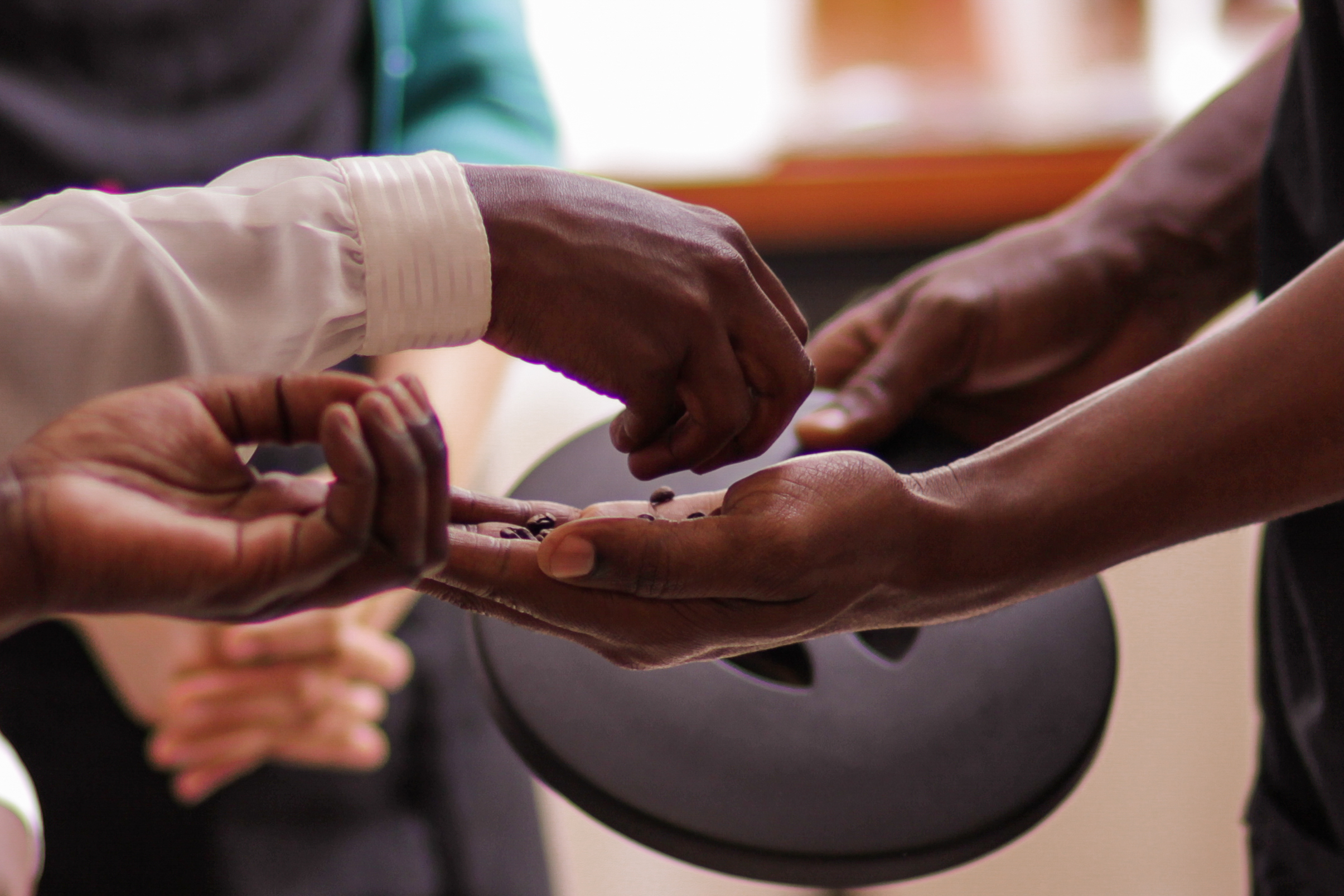 Hands sharing coffee - Reforged™ Reentry Operating System
